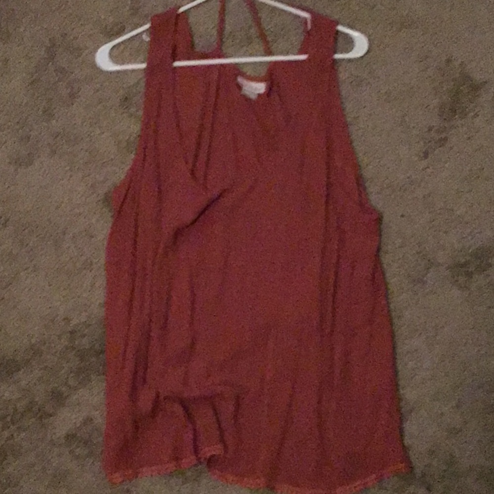 Orange tank top it’s straps made by belle du jour